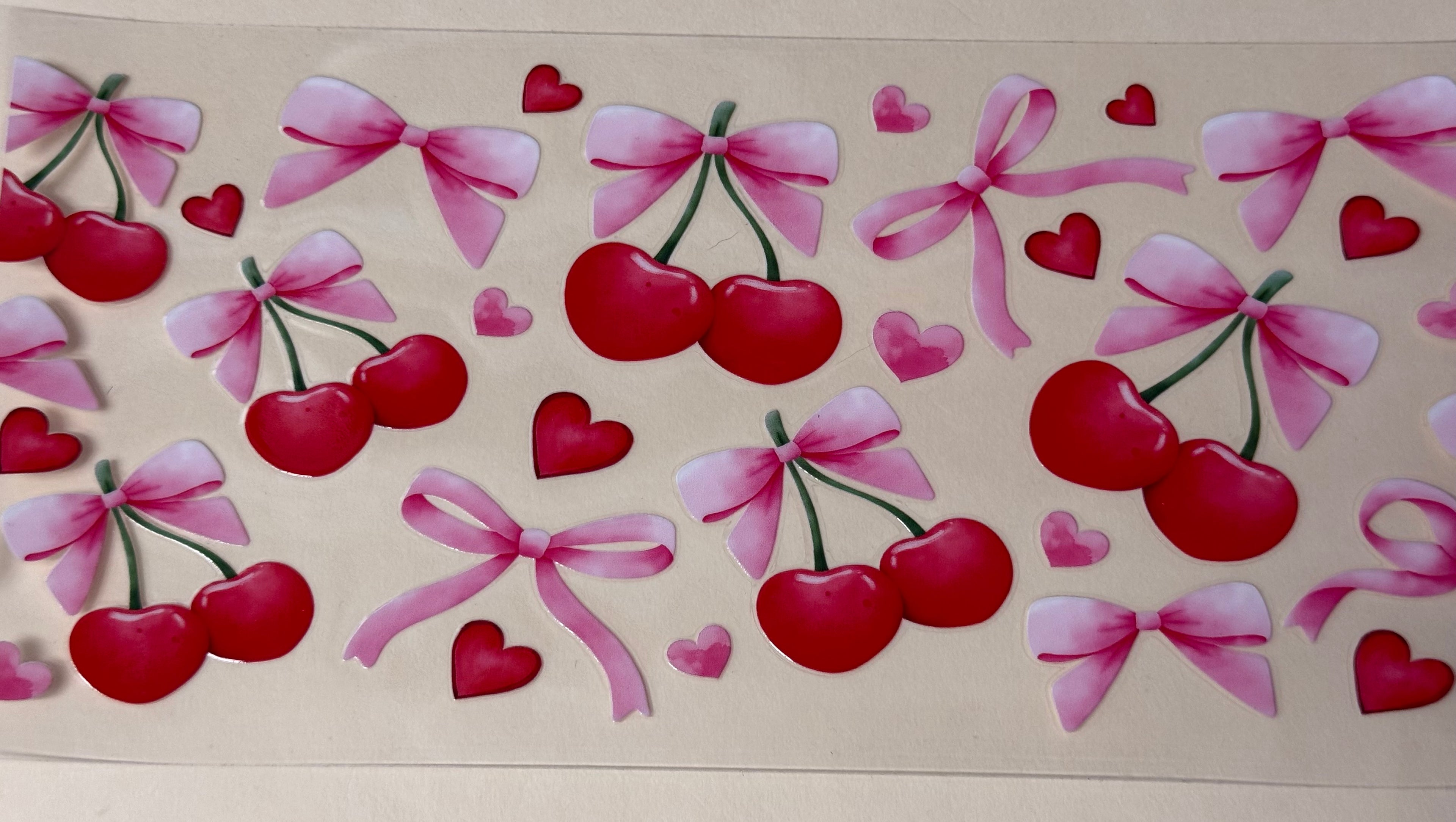 Cherry with pink bow
