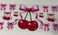 Big red cherry  with pink bow