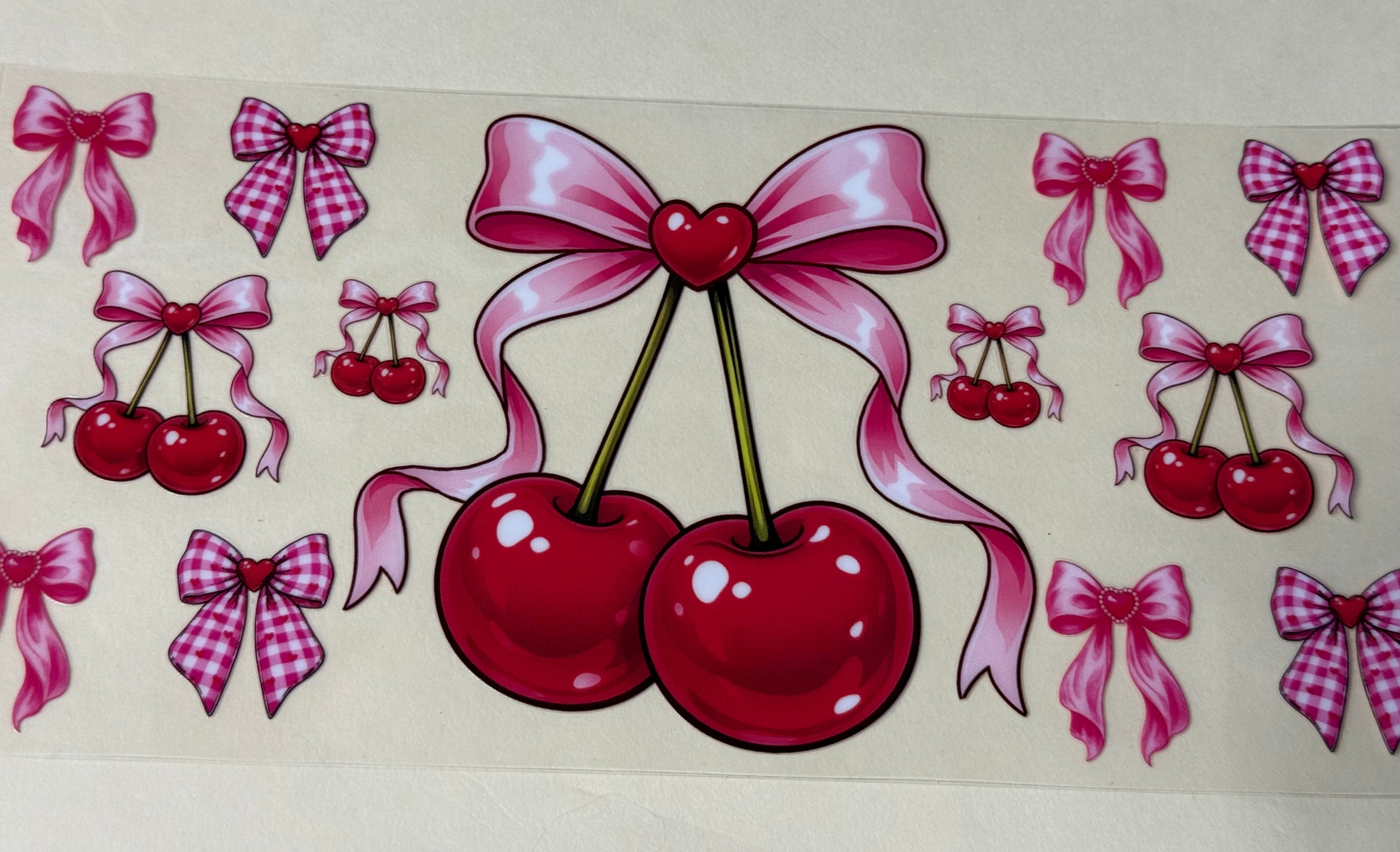 Big red cherry  with pink bow