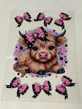 cow with pink black bow