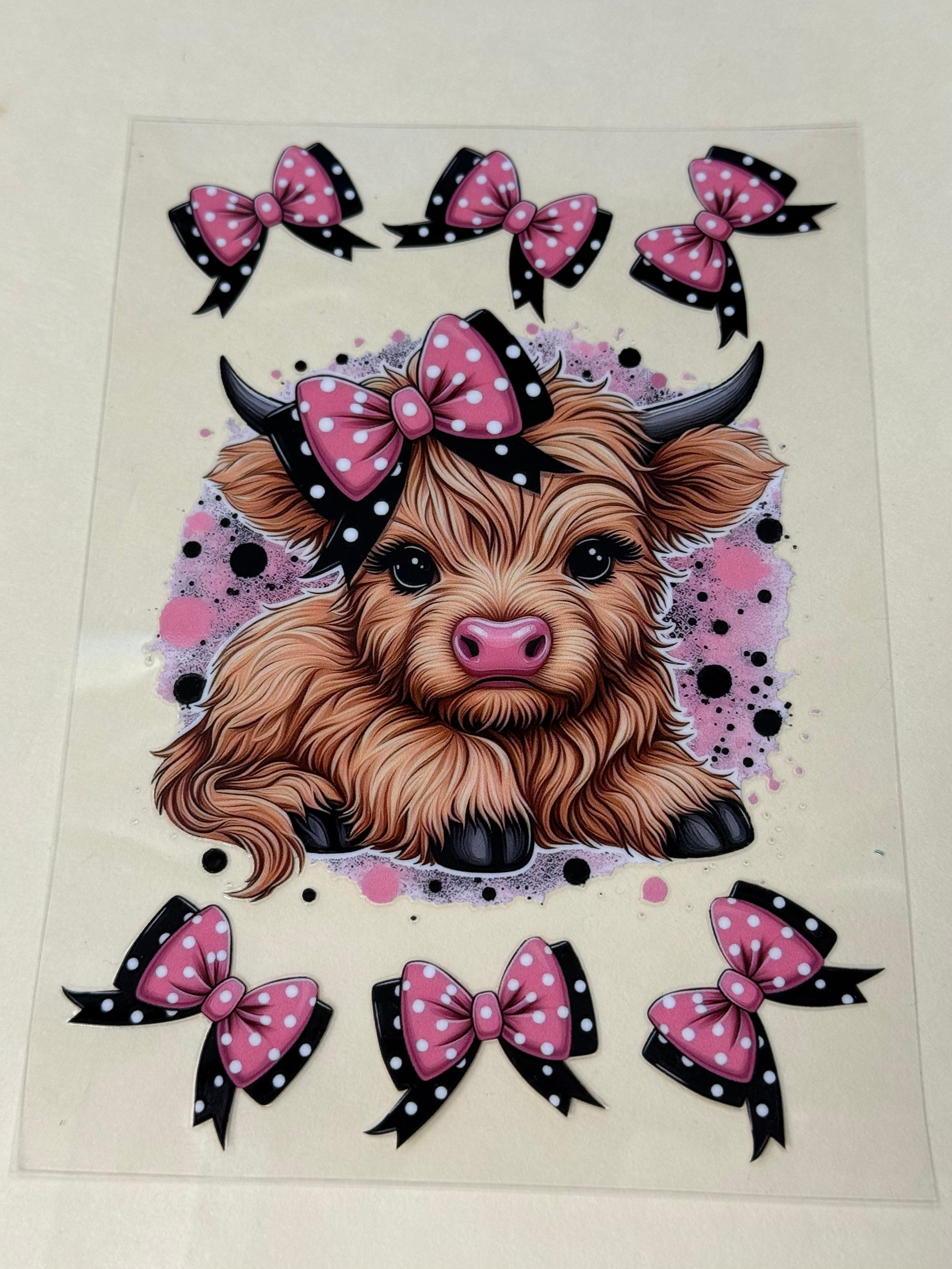 cow with pink black bow