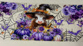 cow with purple pumpkins and a which hat